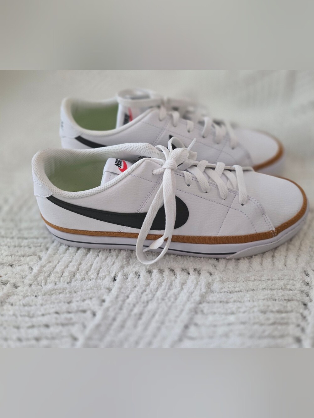 Nike White Leather Sneakers with Black Swoosh and Tan Stripe